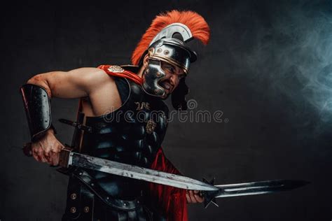 Angry Armoured Roman Soldier With Dual Swords Attacks Stock Photo ...