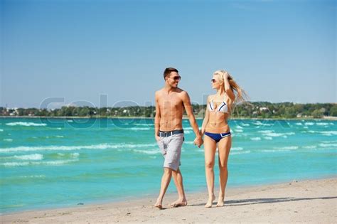 Couple walking on the beach | Stock Photo | Colourbox