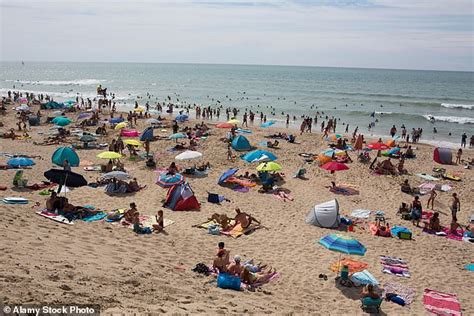 Topless beach 'causes town to go bust' as locals are forced to shop