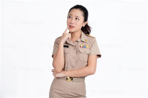 Portrait of young Asian teacher standing thinking something isolated on
