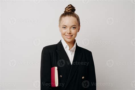 Female boss in dark suit with notebook expressing success 8828586 Stock