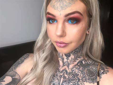 Aussie woman spent $70k on tattoos & body mods coz she hated how she
