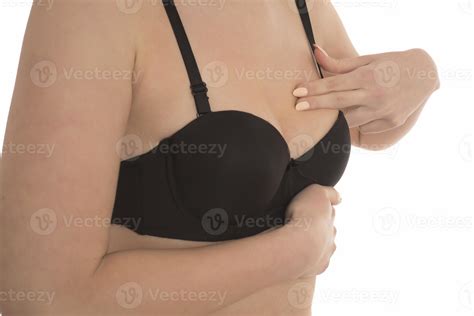 woman doing breast self-exam BSE. Checking up breast changes, possible