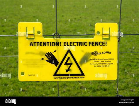 Electric Fence Warning Sign Stock Photo - Alamy