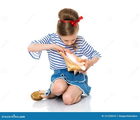 Little girl with sea shell stock photo. Image of blue - 121228476