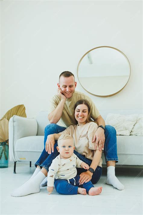 Premium Photo | Young parents are playing with their little 10monthold