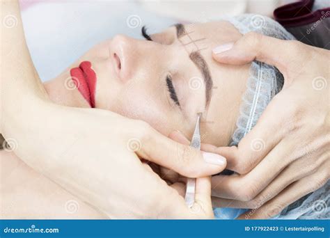 Microblading Eyebrow Tattoo Procedure in a Beauty Salon Stock Image ...