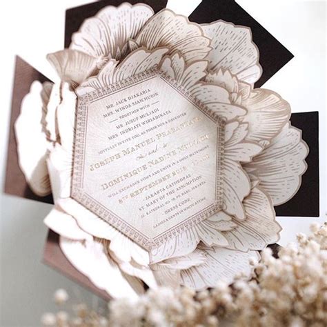 A flower themed holy matrimony invitation wrapped neatly in a hexagonal box for Joseph & Nadine ...