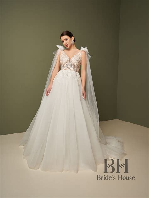 A-line wedding dress with semi-sheer bodice in nude, straps, open back