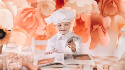 Happy Boy Chef Chooses a Cooking Recipe Stock Photo - Image of cookee ...