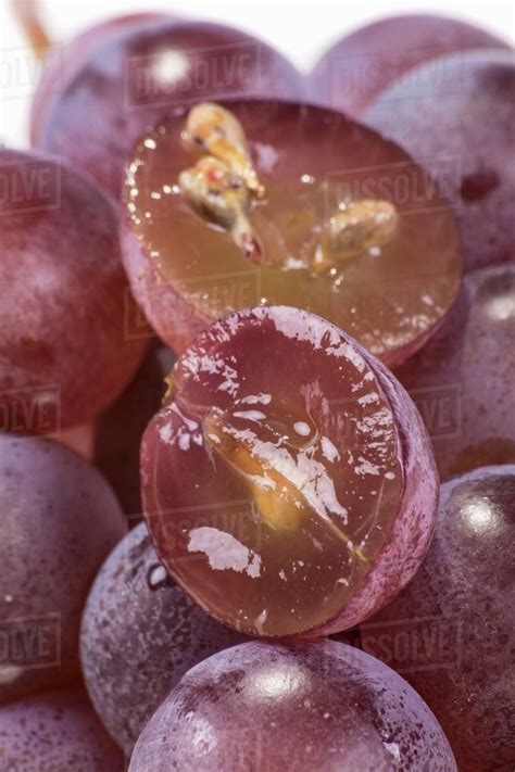 red grapes   halved close  royalty  stock photo