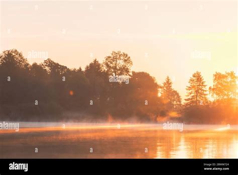 Lake during sunrise, Germany Stock Photo - Alamy