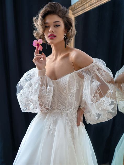 Strapless A-line wedding dress with long puffy sleeves