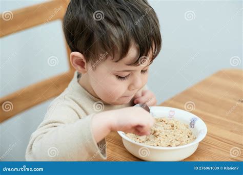 Young Boy Eating Oatmeal for Breakfast Stock Image - Image of little ...