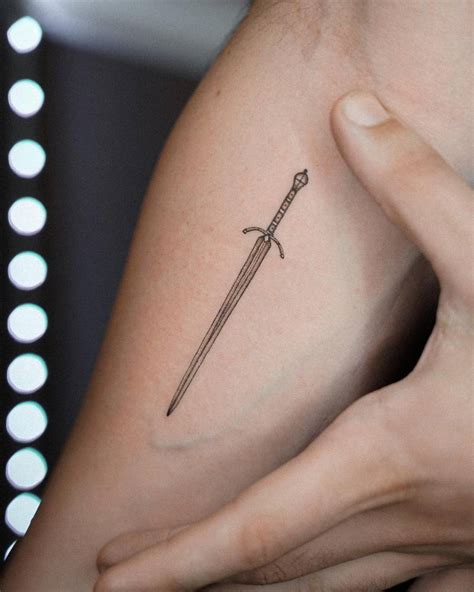 simple sword tattoo designs male