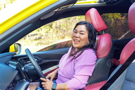 Asian woman and car with sun loop roof Red-black leather seats concept