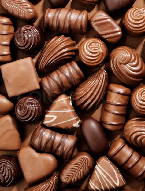 Assorted Chocolate pralines on brown background | Stock image | Colourbox