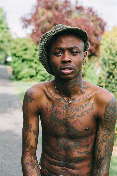 "Tattooed Black Man Portraits" by Stocksy Contributor "Kkgas" - Stocksy