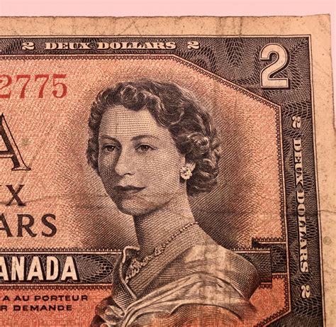 1954 DEVIL'S FACE CANADIAN $2 BILL - Kidd Family Auctions