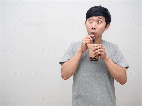 Asian man sucking boba tea and looking at copy space 16789855 Stock