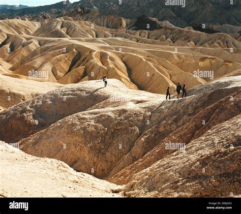 People hiking across Zabriskie Point, California Stock Photo - Alamy