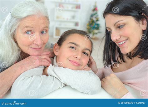 generations family resting  couch stock photo image