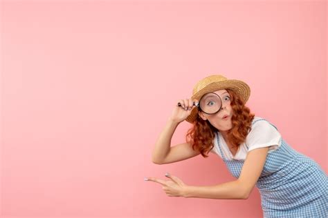 Free Photo | Front view female tourist holding magnifier