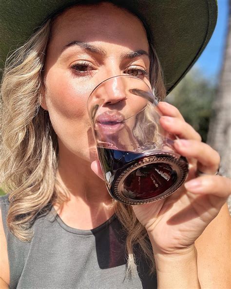 Amanda Balionis | Wearing green ☘️ sipping 🍷…that’s at least half the