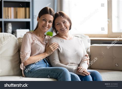 portrait smiling young woman cuddling affectionate stock photo
