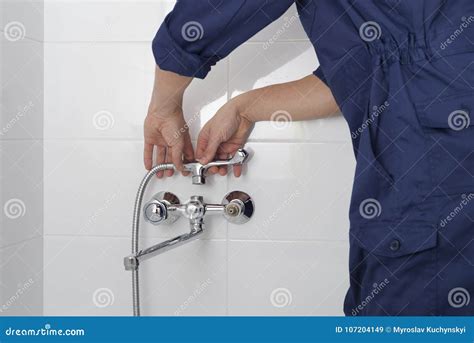 Repair of a water tap stock image. Image of plumber - 107204149