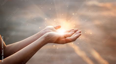woman hands praying  blessing  god  sunset background stock