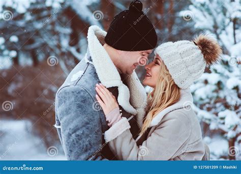 Winter Portrait of Happy Romantic Couple Embracing and Looking To Each ...