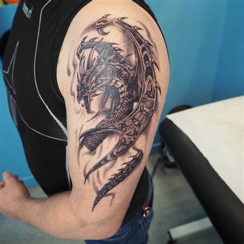 large-dragon-shoulder-tattoo-man-wearing-a-black-top-jeans-forearm ...