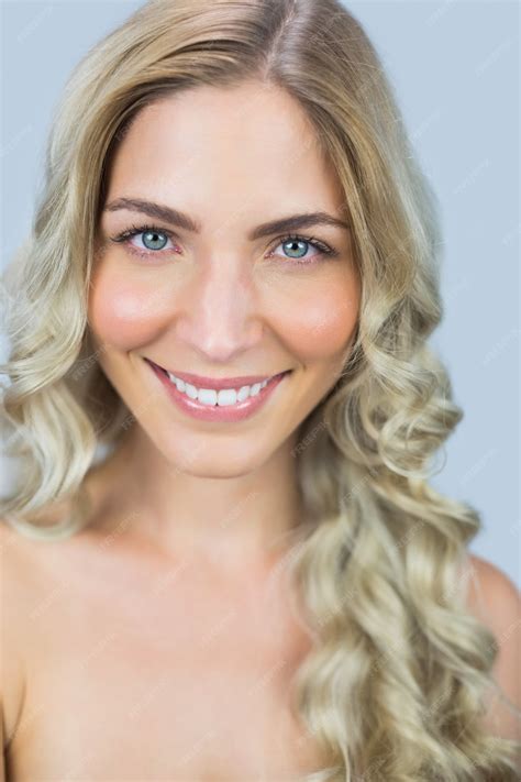 Premium Photo | Smiling beautiful natural blonde posing