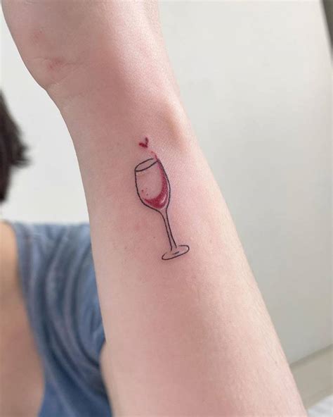 Fine line wine glass tattoo