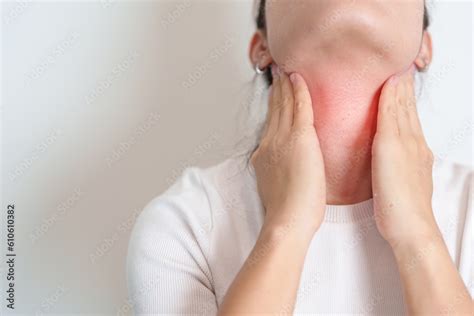 Woman checking Thyroid gland disease. Hand holding Neck pain ...