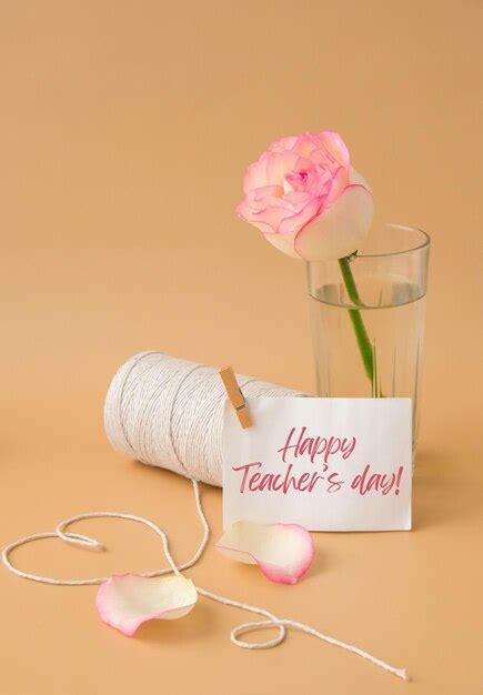 Premium Photo | Happy teachers day text tender pink roses with spool of ...