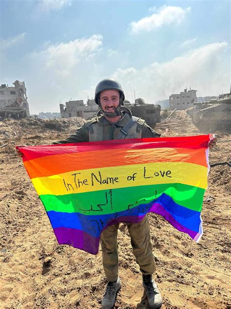 Gay Israeli soldier Yoav Atzmoni proudly displays LGBTQ flag on Gaza