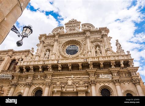 The richly decorated façade of the basilica of Santa Croce with statues ...