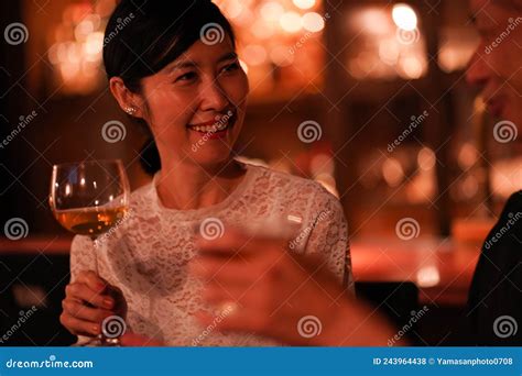 Woman drinking at the bar stock photo. Image of business - 243964438