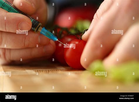 Cook in kitchen introduces secret ingredient Stock Photo - Alamy