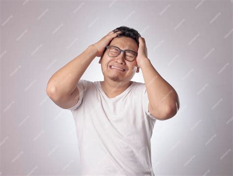 premium photo photo image  funny asian man crying close  eyes