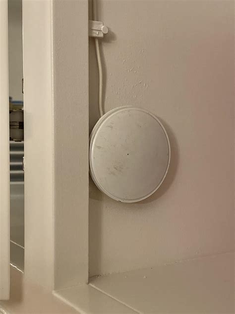 What is this flat, round puck with a single wire attached? It’s about 2