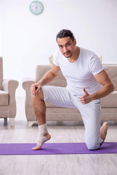 Leg Injured Man Doing Exercises at Home Stock Photo - Image of athletic ...