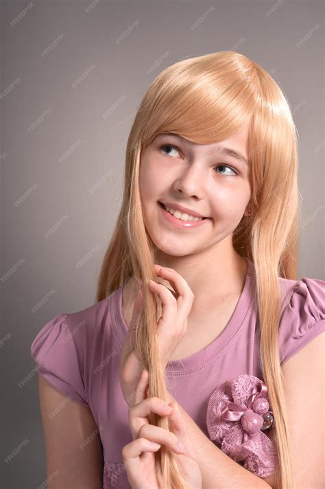 Premium Photo | Portrait of blonde girl posing in studio