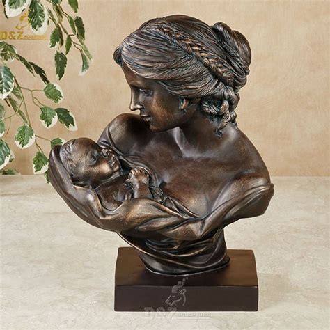 mother holding baby bust statue