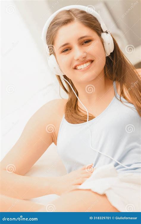 Comfortably Lying, Enjoys Soothing Melodies on Couch Stock Image ...