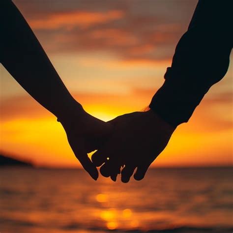 sunset holding hands image sunset silhouette ocean