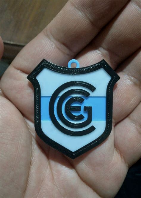 STL file KEY RING - GYMNASIA Y ESGRIMA DE JUJUY COAT OF ARMS 🔑 ・3D