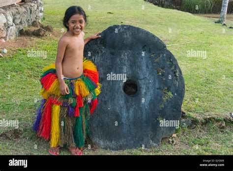 Yapese girl in traditional clothing with stone money at Yap Day Festival, Yap Island, Federated ...